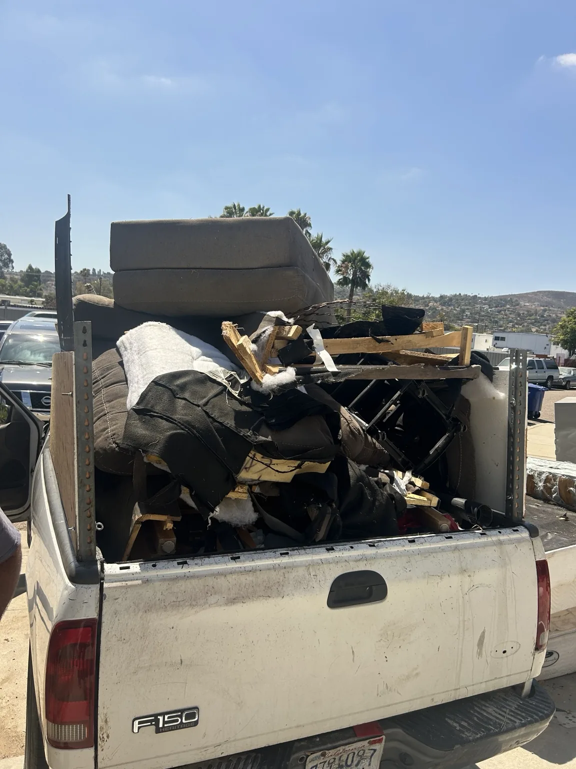 Truck fully loaded with couches and household furniture