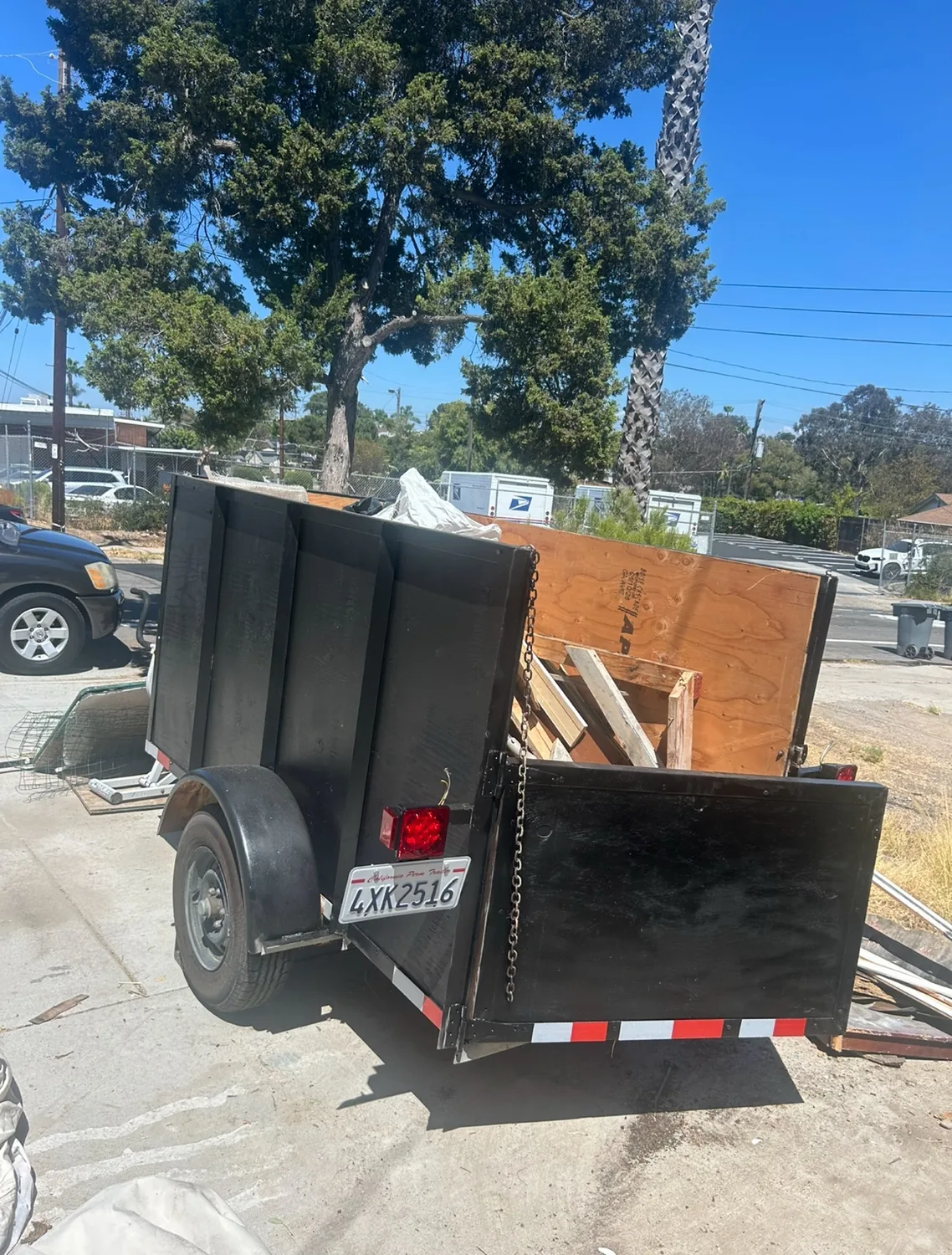 Trailer loaded with construction and cleanup debris